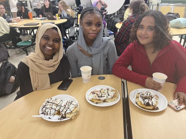 Ciram Shargawi 25, Omnia Ahmed 26 and Iman Alnour 26 pose with their pancakes at BPAs last meeting of 2023. 