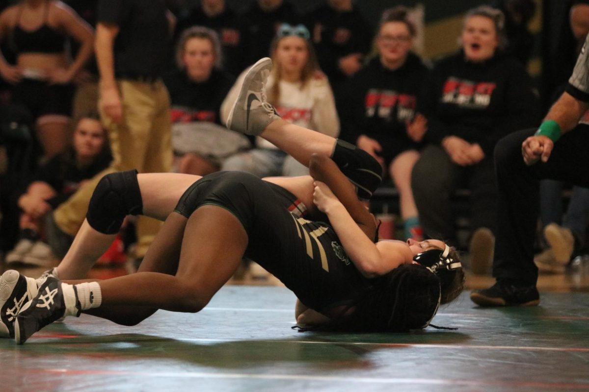 Trinity Myers 25 attempts to get a reversal against her opponent Dec. 7 against Western Dubuque. 