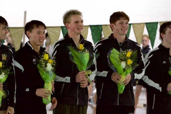 Seniors Holden Carter, Max Gerke 24 and Dillon Croco 24 smile after their senior recognition.