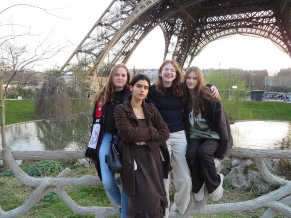 Helen Orszula 24, Sila Duran 23, Josie Schwartz 25, and Erinn Varga 24 pose in front of the Eiffel Tower in Paris, France.