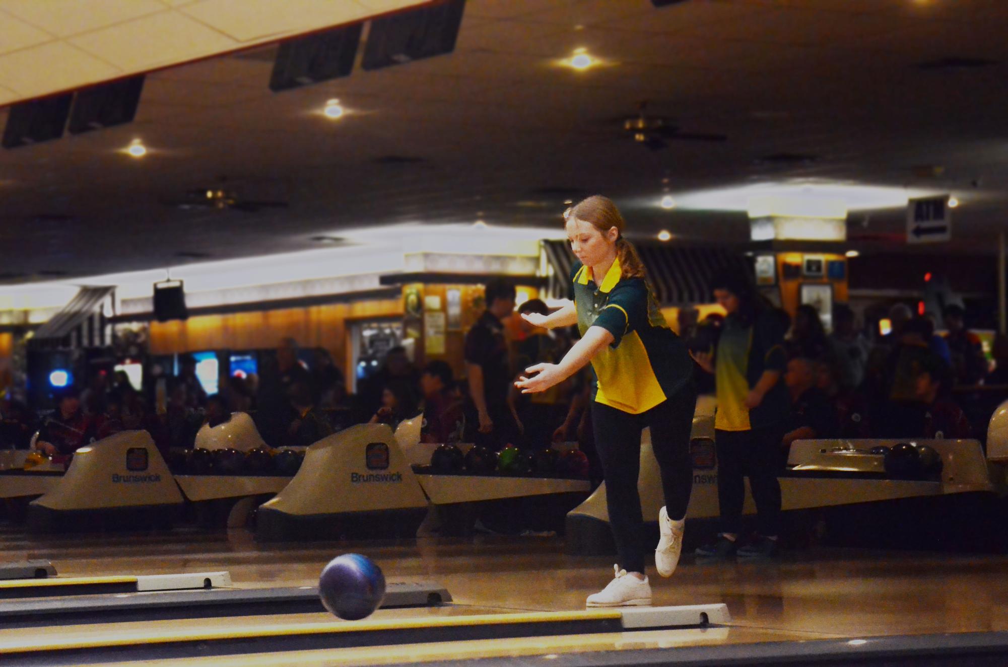 Mackenzie Oberbrockling '25 steps up to her mark and bowls, finishing with a 251 series during the Battle for the Pins Feb. 9, 2024.