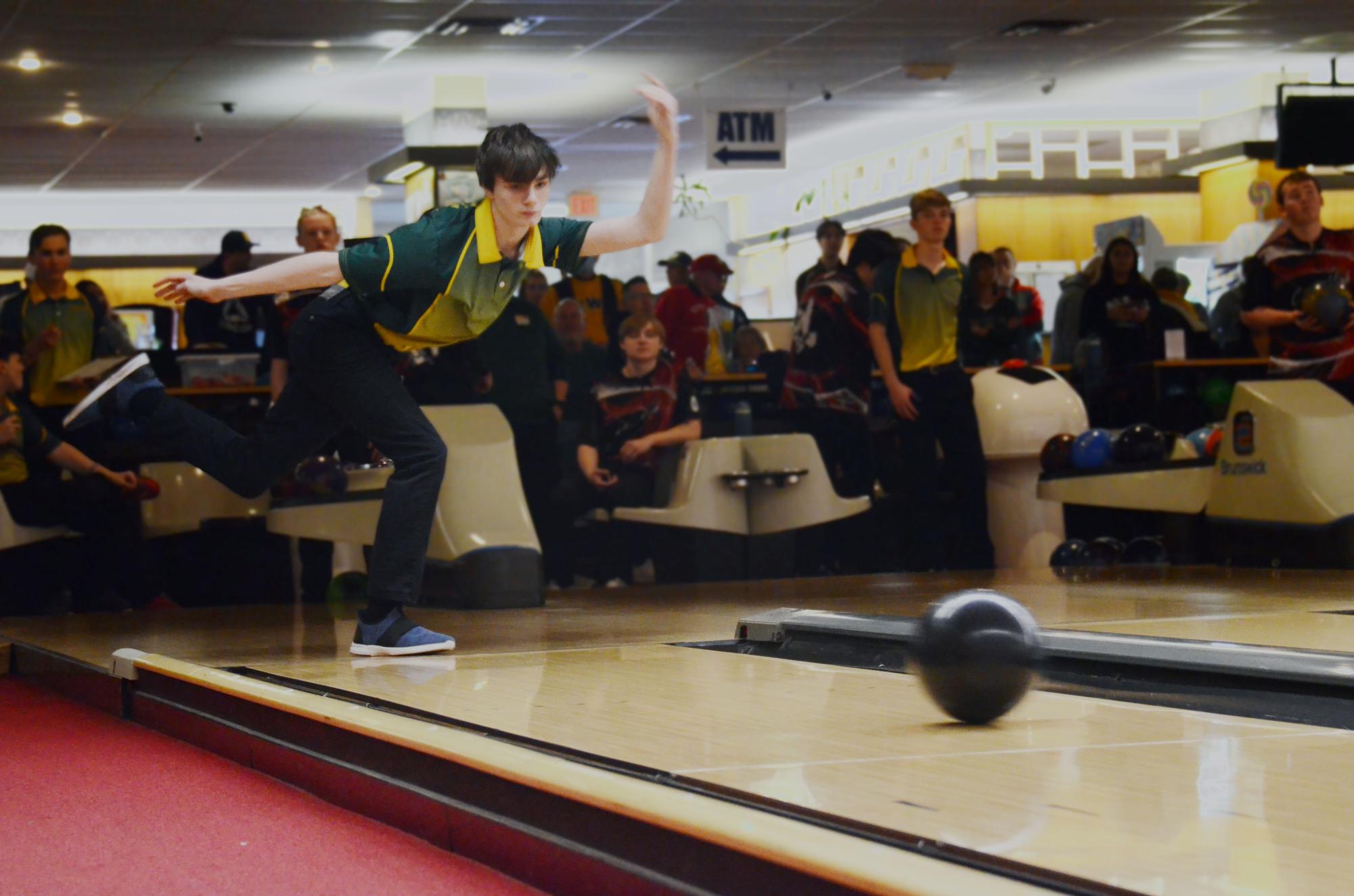 Cayden Day '25 watches his curved bowl, finishing with a 455 series during the Battle for the Pins Feb. 9, 2024.