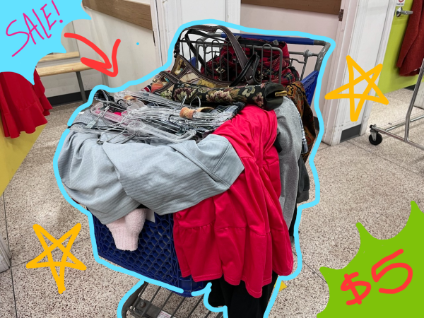 A Goodwill cart overflowing with clothes.