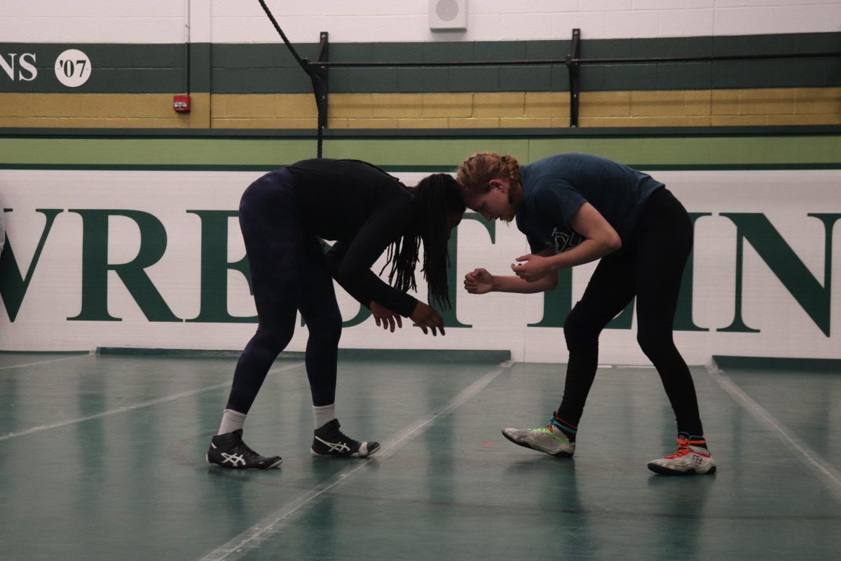 During practice, Trinity Myers 25 and Helen Orszula 24 sparr after school in the wrestling room. Both wrestlers are preparing for state that is coming up on February 1st-2nd.