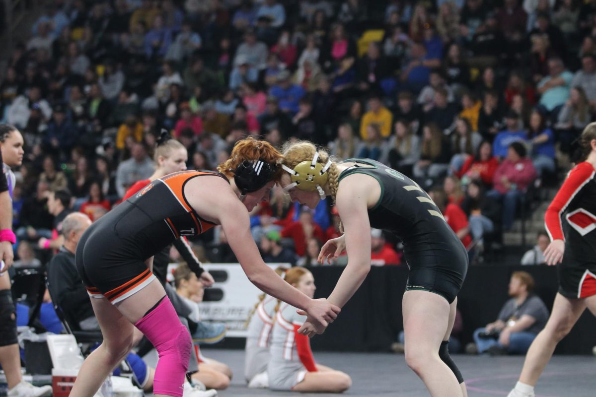Peyton Van Dyke 26 goes head to head with her opponent at the second annual girls wrestling state tournament Feb. 1. 