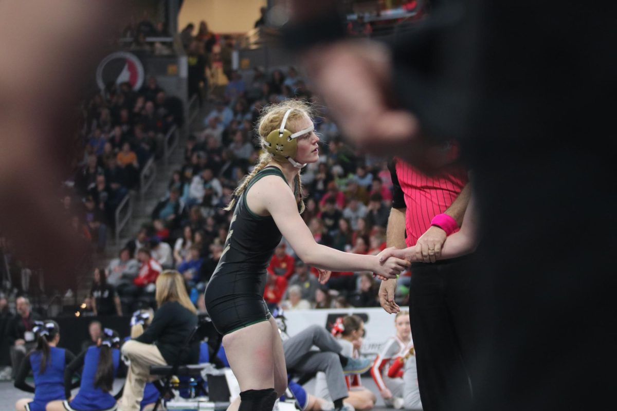Peyton Van Dyke 26 shakes her opponents hand after the first round of the girls State tournament. 