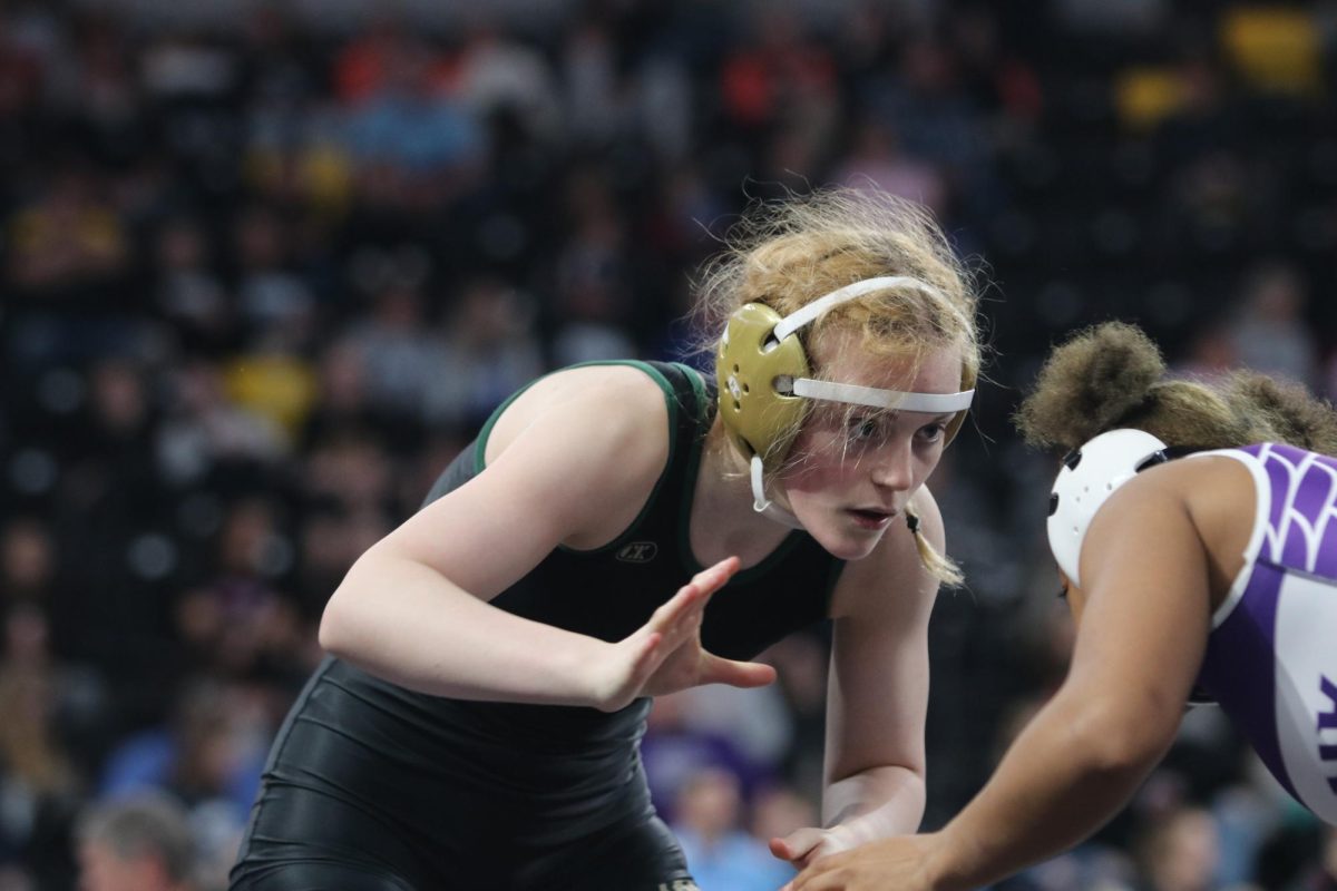 Peyten Van Dyke 27 getting ready to attack her opponent in her final match at the Girls State Wrestling meet Feb. 3.
