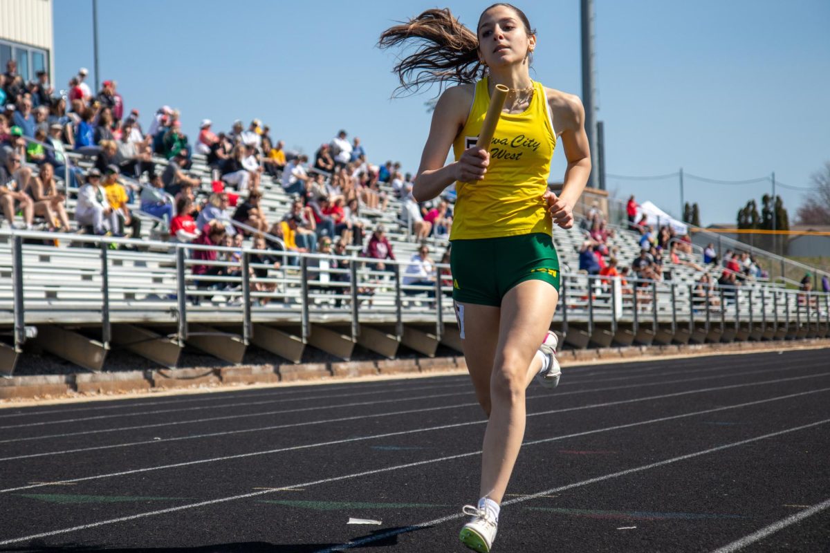 Caroline Dickens 27 Looks to finish her leg of a relay on April 13. 