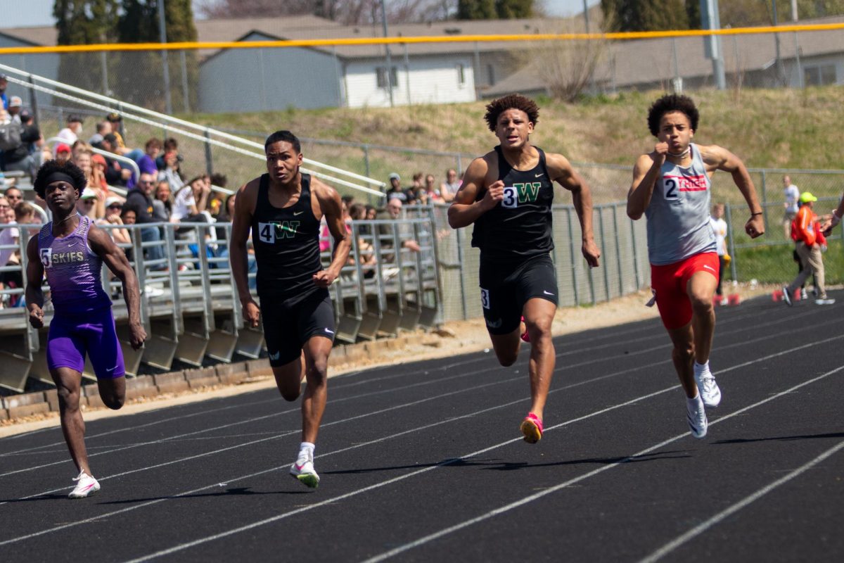 Izaiah Loveless 24 and Mason Woods 25 race the 100-meter race on April 13 at Eastern Iowa Track and Field Festival.  