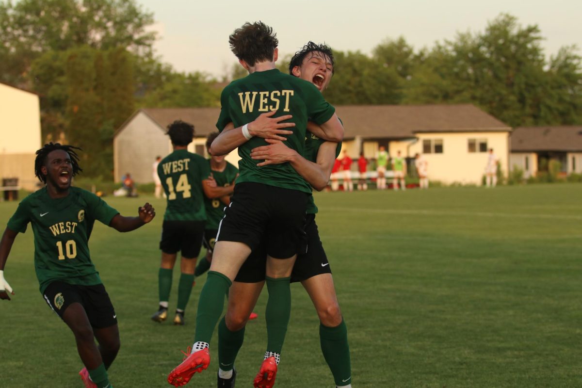 Caden Crabtree 25 embraces Daniel Fuentes 25 after he scored a halftime goal, tying the game 2-2.