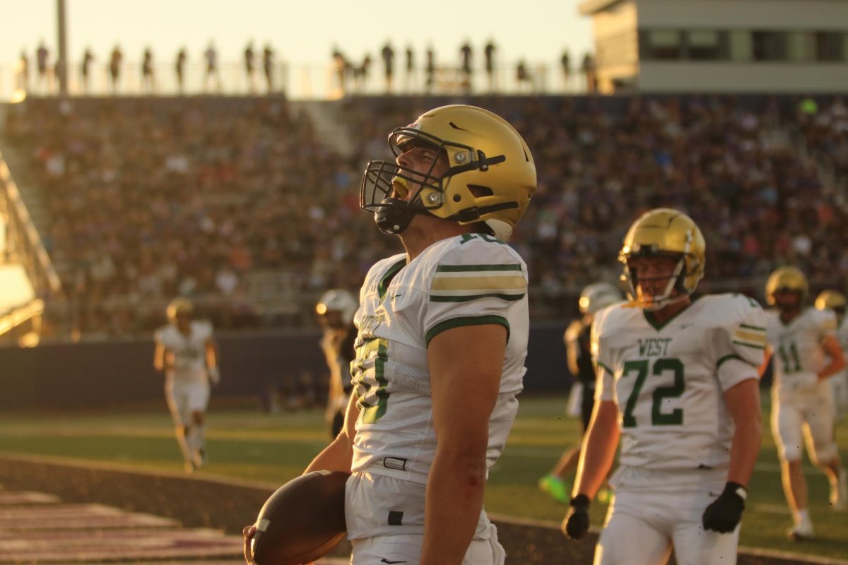 Jack Wallace '25 celebrates after scoring a touchdown.