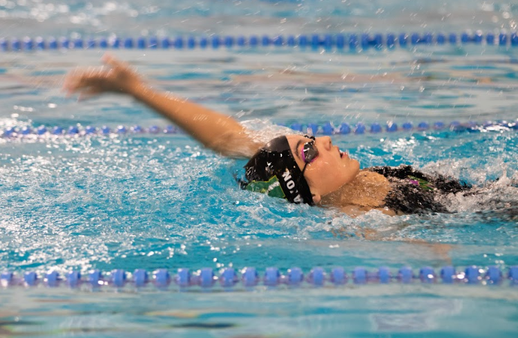 Anna Bayon '28 swims the backstroke at the Coralville Recreation Center Sept. 10.