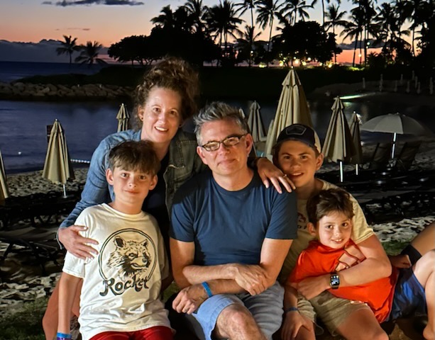 Steven Caulk sits with his family. Photo courtesy of Steven Caulk.