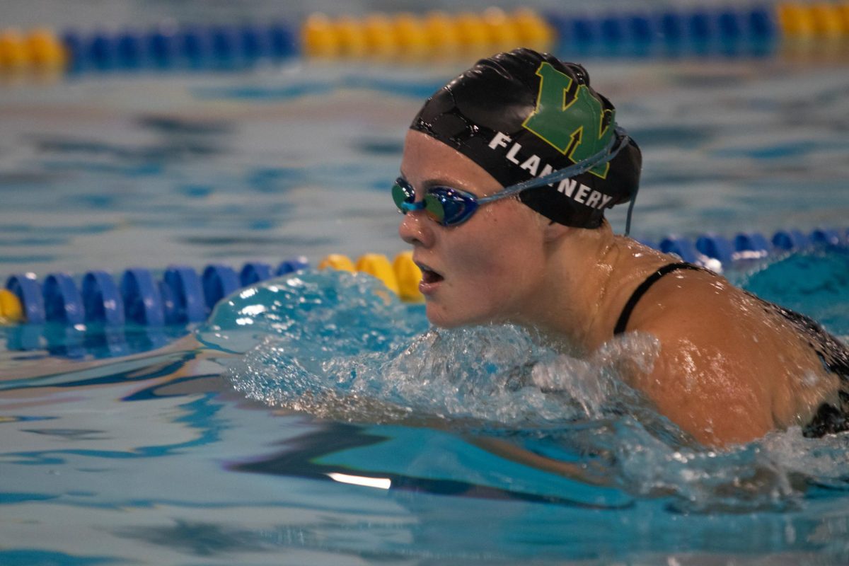 Kate Flannery '26 comes up for a breath during a race on Sept. 10.