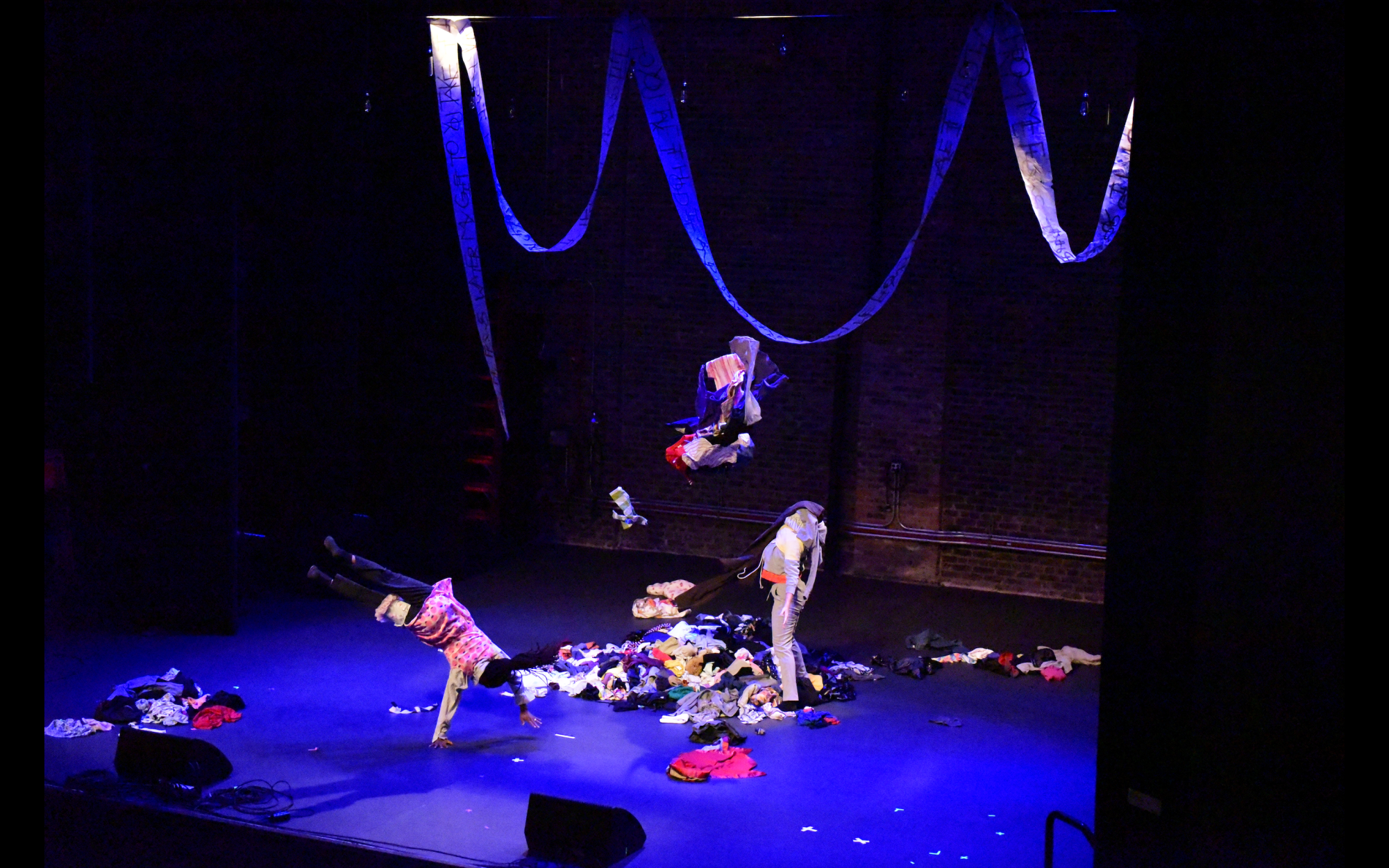 Both Culbreath performers throw clothing garments while dancing passionately. 