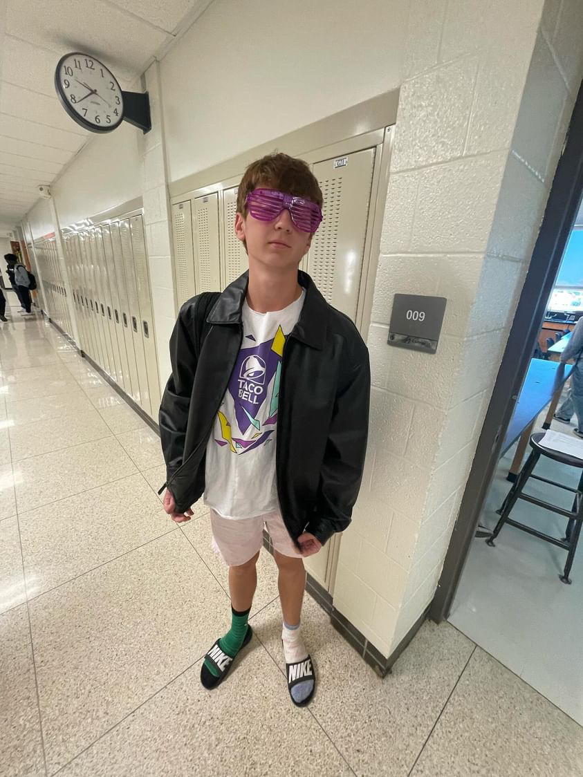 Brady Olson '25 sports his mismatched socks and Taco Bell shirt for Worst Outfit Day Oct. 2.
