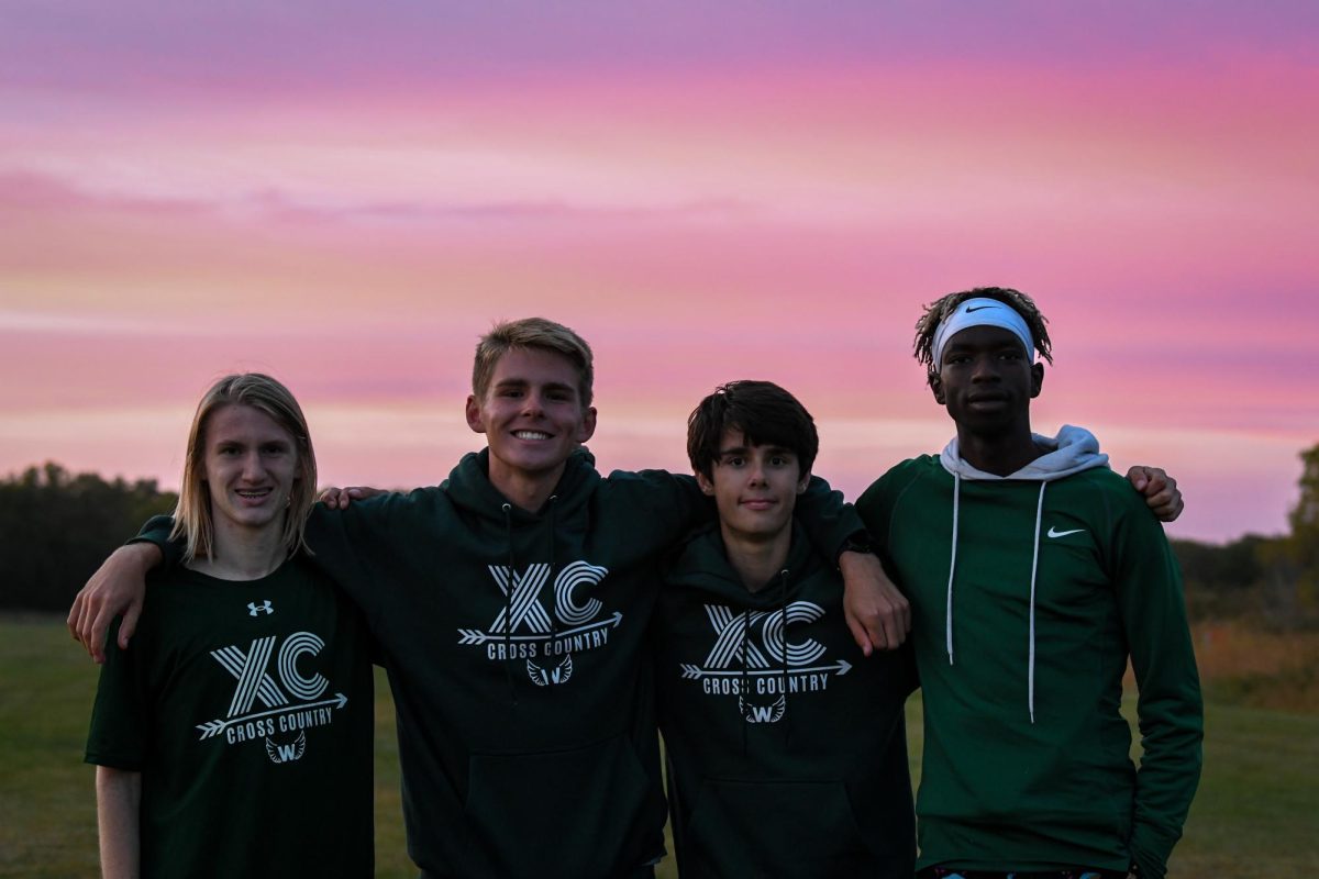 Varsity placers Evan Merrill '27, Colin Werhle '27, Michael Hanna '28 and Moustafa Tiea '25 smile for the camera. 