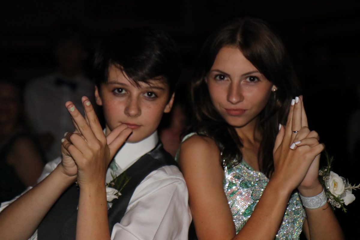 Harper Ray '27 and Sadie Abbas '27 pose for a photo during the dance Oct. 5.