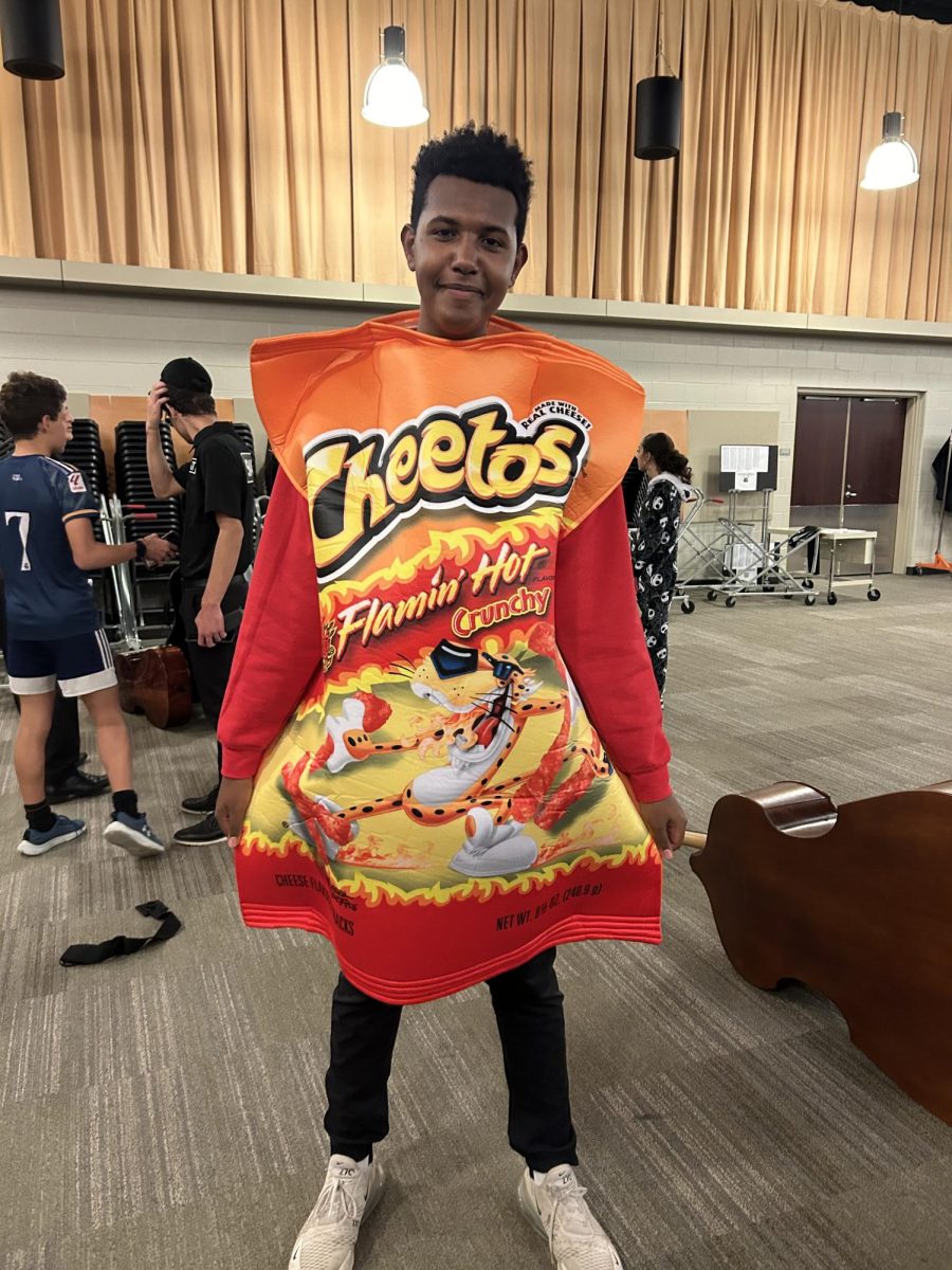 Solomon Schaffer '26 dresses as a Hot Cheeto bag. 