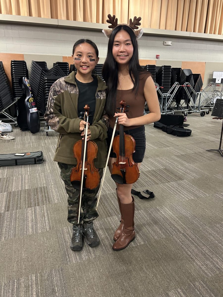 Tina Hong '25 and Sabrina Du '25 dressed up as a hunter and a deer. 