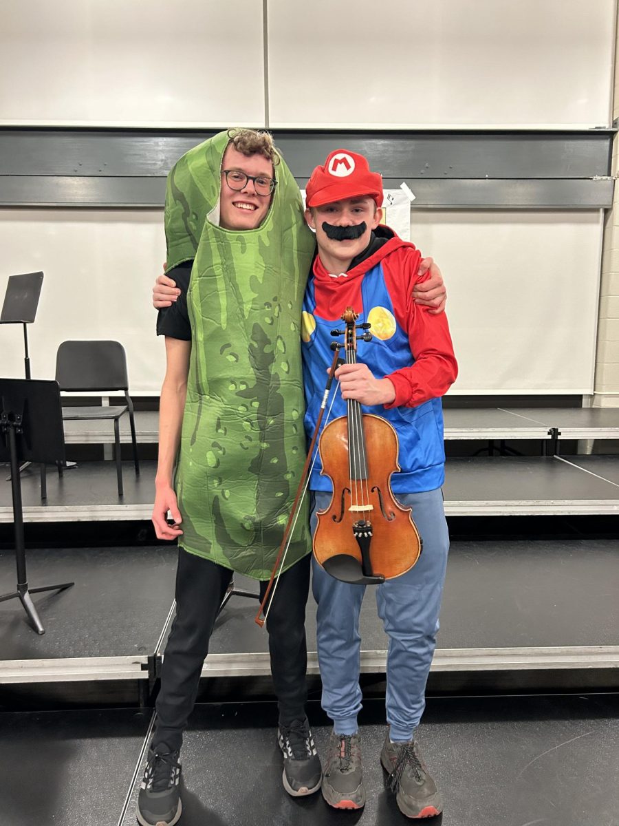 Alex Forbes '26 and Kobi Nott '26 pose together as a pickle and Mario, respectively. 