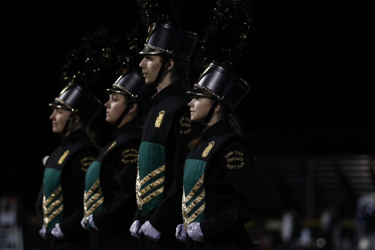 Drum Majors walk on to the field to begin the performance. 