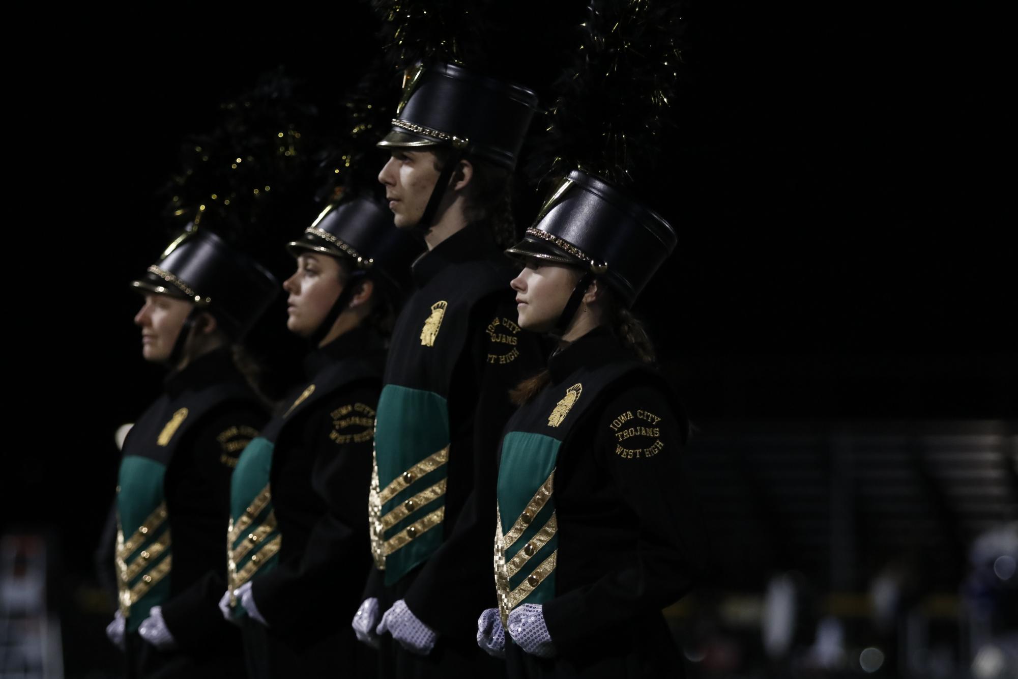 Drum Majors walk on to the field to begin the performance. 