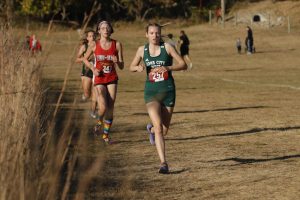 Kalli Titus '25 leads a pack of runners Oct. 17 at Seminole Valley Park.