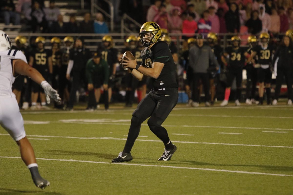 Jack Wallace '25 gets ready to pass the ball on Oct. 18 against Pleasant Valley