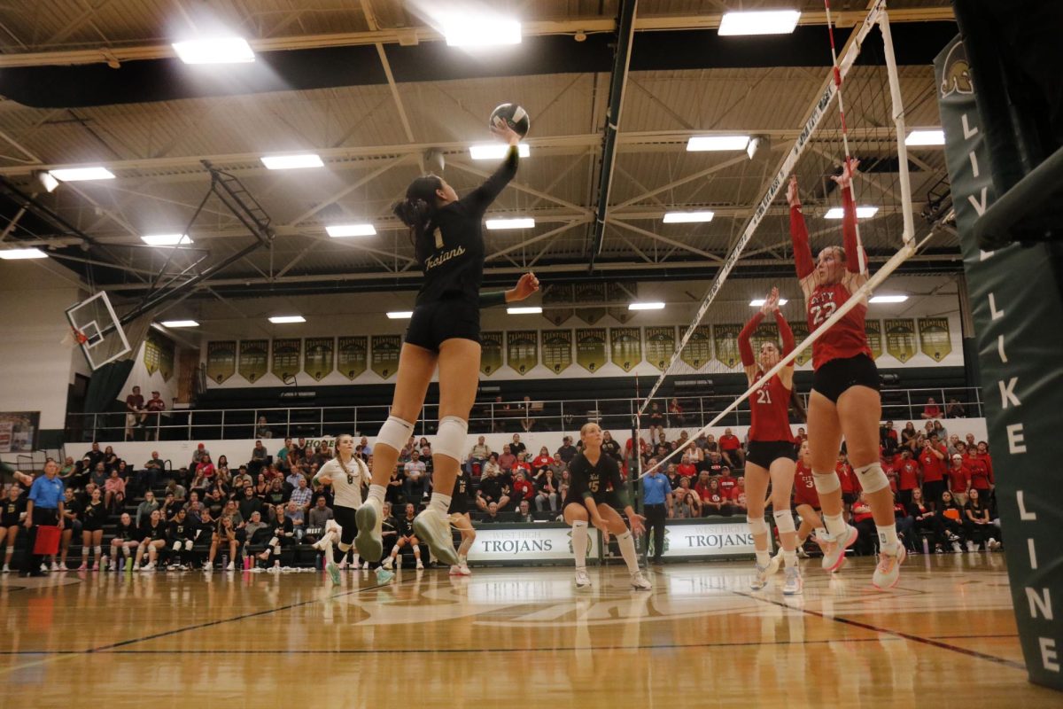 Gracie Liu ’27 pushes the ball over the net in a fake Spike and bags a point for West. 