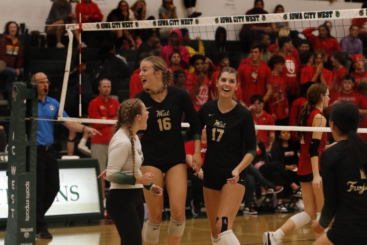After Scoring a point in the third set number 16 Sophia Austen ’27 and number 17 Audrey Small ’28 celebrate together. 