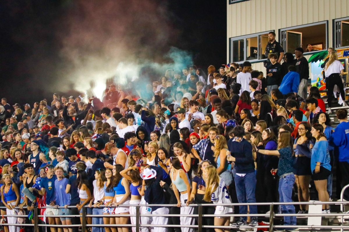 On Oct. 4, the West High student section throws up colorful arrays of chalk at the Homecoming football game against Cedar Rapids Kennedy.