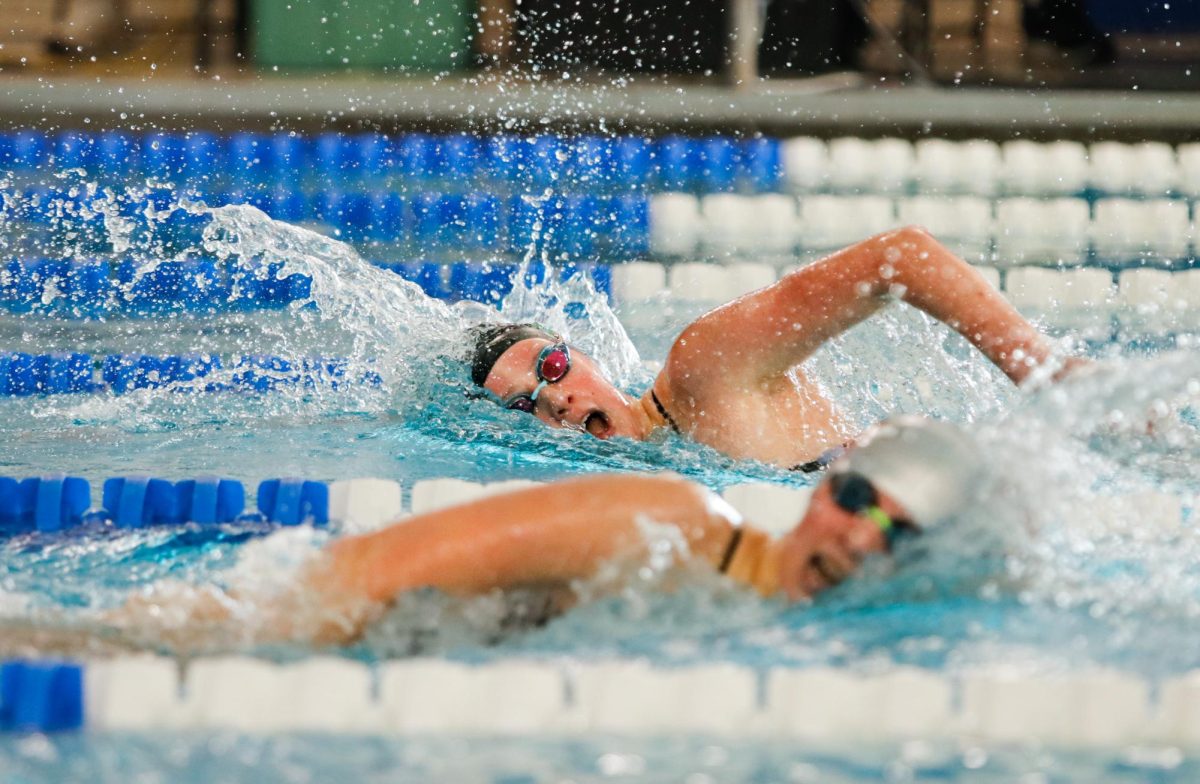 Gretchen Gerke '26 races against competitors in the 500Y Freestyle during the girls swim conference meet Oct. 26. 