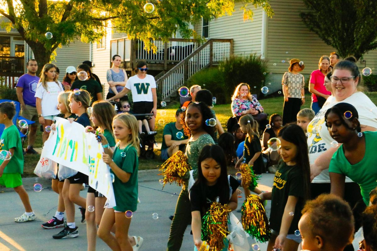 Elementary students walk in the Homecoming parade Sept. 30.