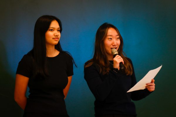 Executive board members Claire Hahn '25 and Anjali Lodh '25 announce the beginning of the "Fall Fantasia" concert Nov. 15 in the commons area. 