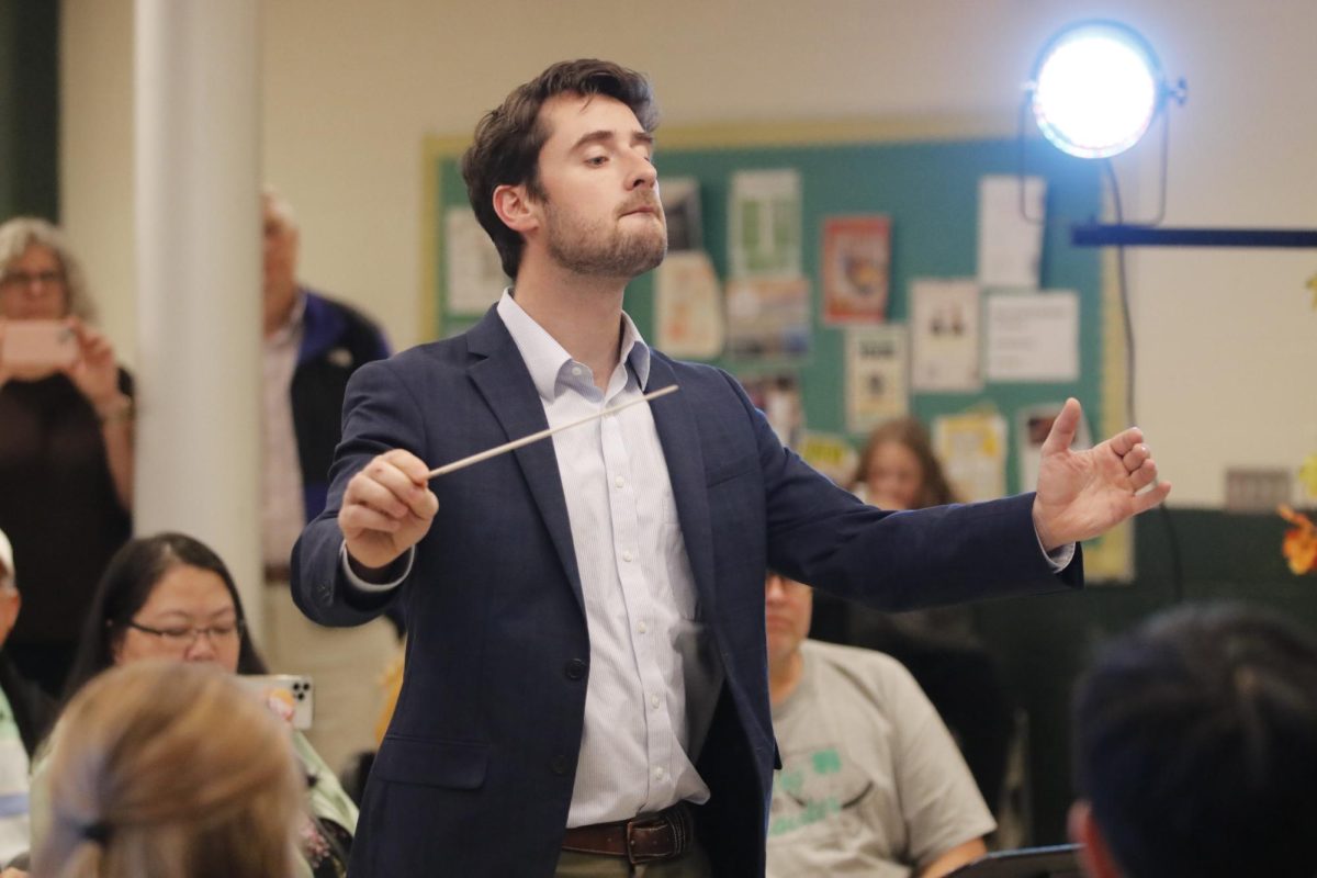 West band director Ryan Middleton conducts "Serenade for Winds" by Antonín Dvořák in the commons area Nov. 15. Middleton formed a chamber ensemble made primarily of wind instruments for the "Fall Fantasia" concert.