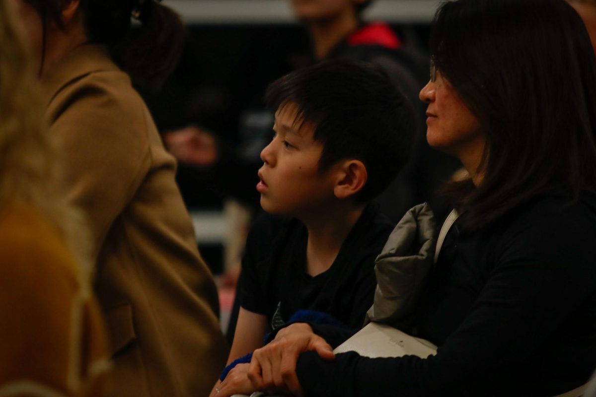 Kotaro Shinozaki '31 and his mother watch the performers at the "Fall Fantasia" concert in the commons area Nov. 15. The concert invites audiences of all ages to ignite a passion for music.