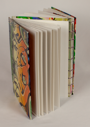 Combining her love of book binding and street art, Sofranko bound two art notebooks together and used magazine cutouts to decorate the outside.