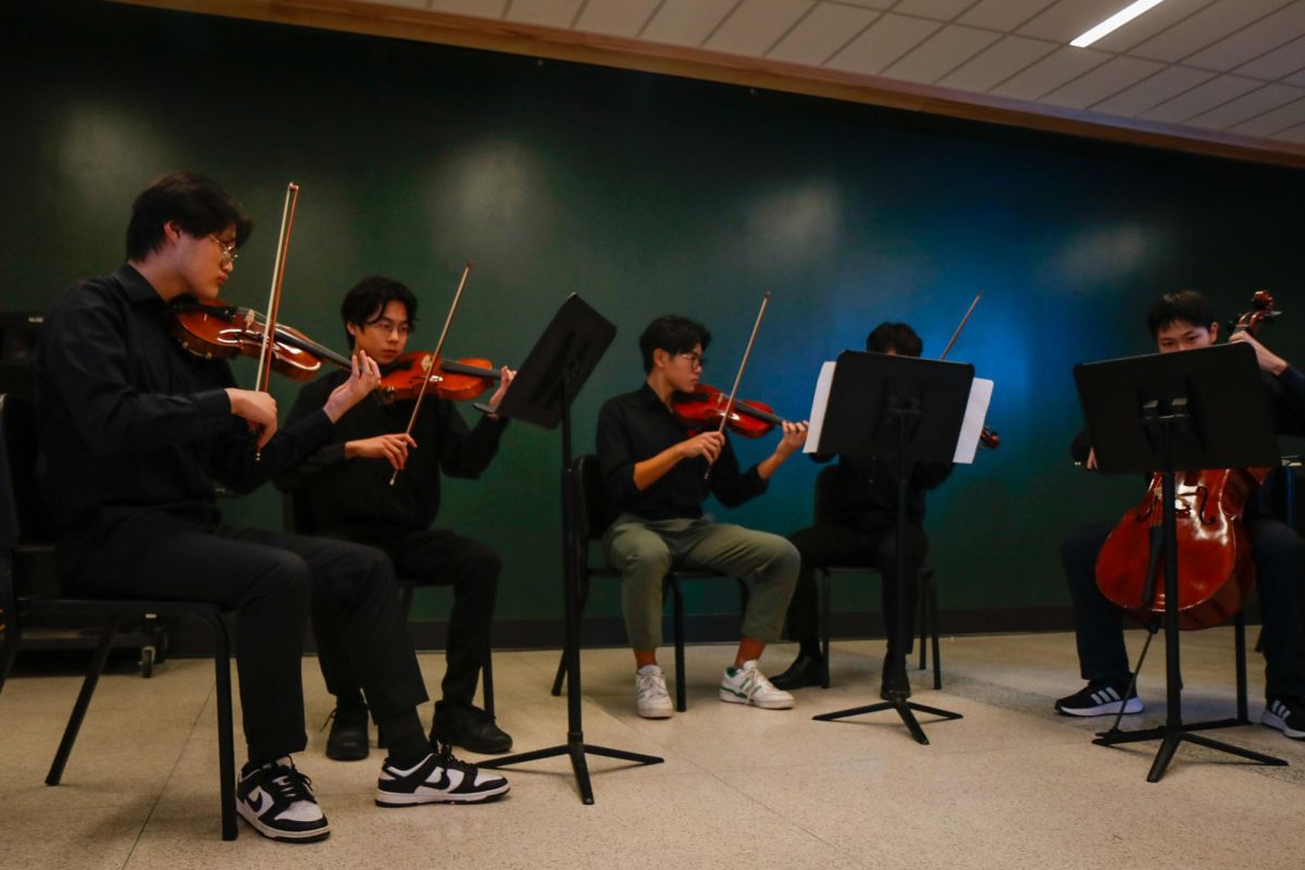 Violinists Ephram Liu '25, Jensen Lin '27, Christian Kim '25 and Derek Hua '25 and cellists Emery Crawford '25 and Ming Yang '25 perform "Merry-Go-Round of Life from Howl's Moving Castle" accompanied by Yifan Liu '25 on piano at the "Fall Fantasia" Nov. 15.