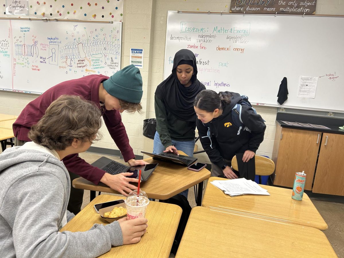 Endrit Ramku '27, Venelin Kotev '26, Waad Dafalla '26, and Ellie Chen '26 discuss fundraiser ideas. 