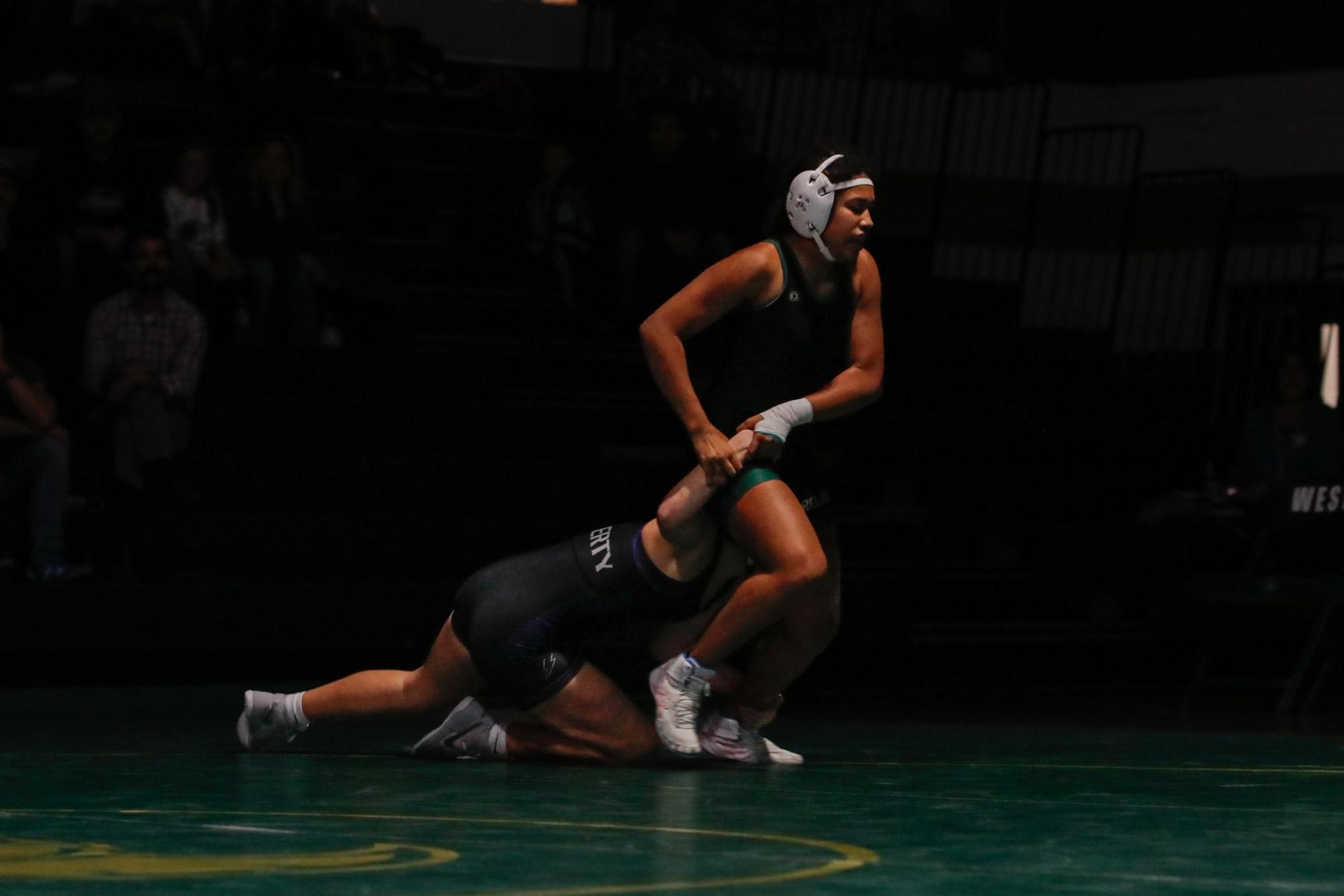 Elyse Caviel fights to keep control in her match against West’s Natalia Gentiluomo ‘25