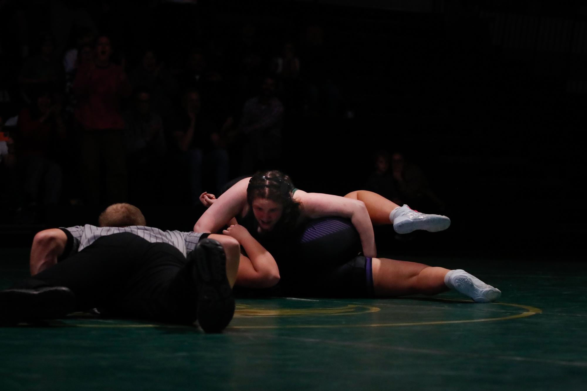 Emerson Reimers ‘28 tilts her opponent, looking for a pin.