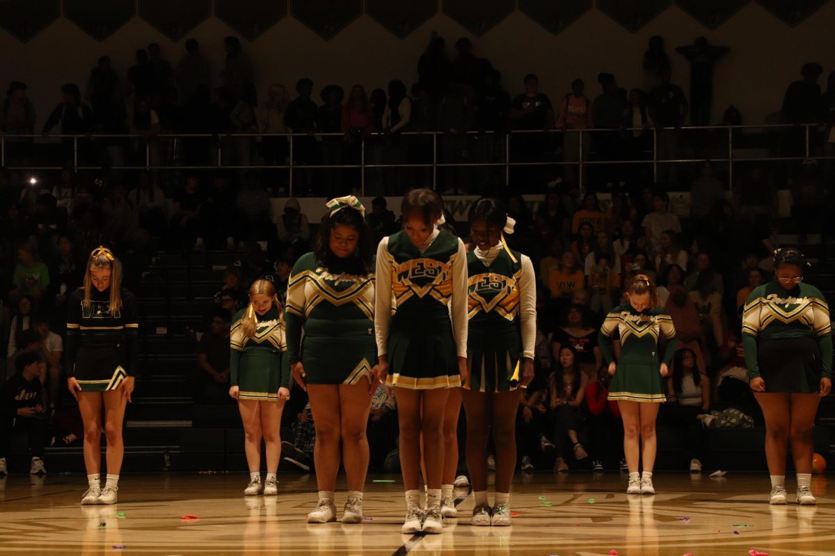 The team waits to preform their dance and stunt. 