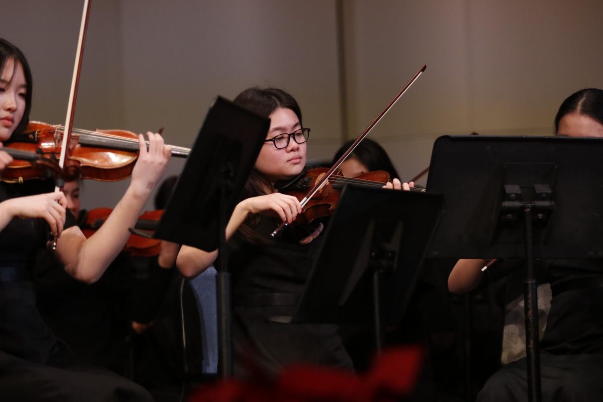 Anna Song '25 leads the second violin section during the concert Dec. 12. 