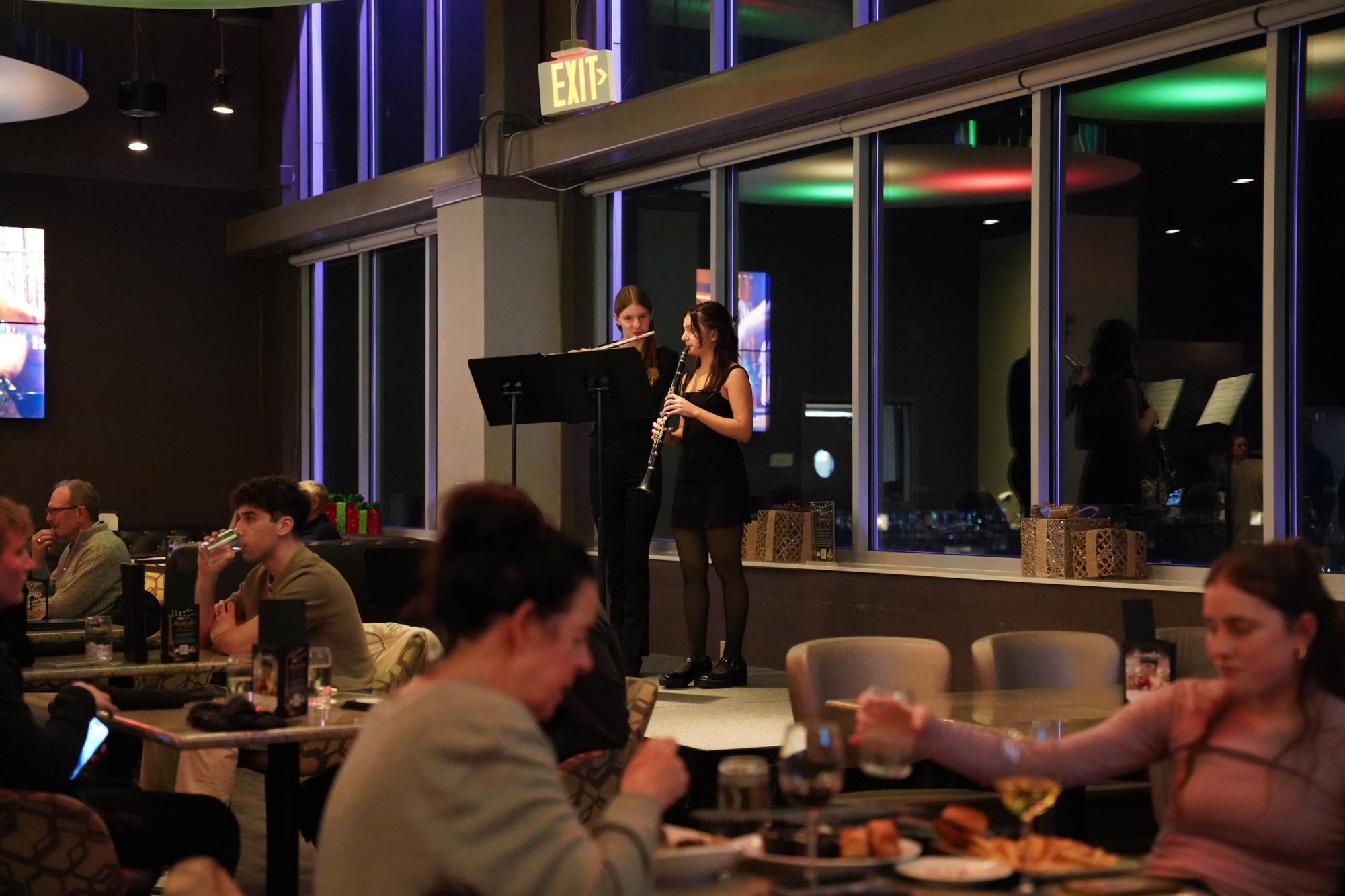 Diners enjoy holiday tunes provided by Cadenza Club alongside their meals at the Vue Rooftoop Dec. 18.