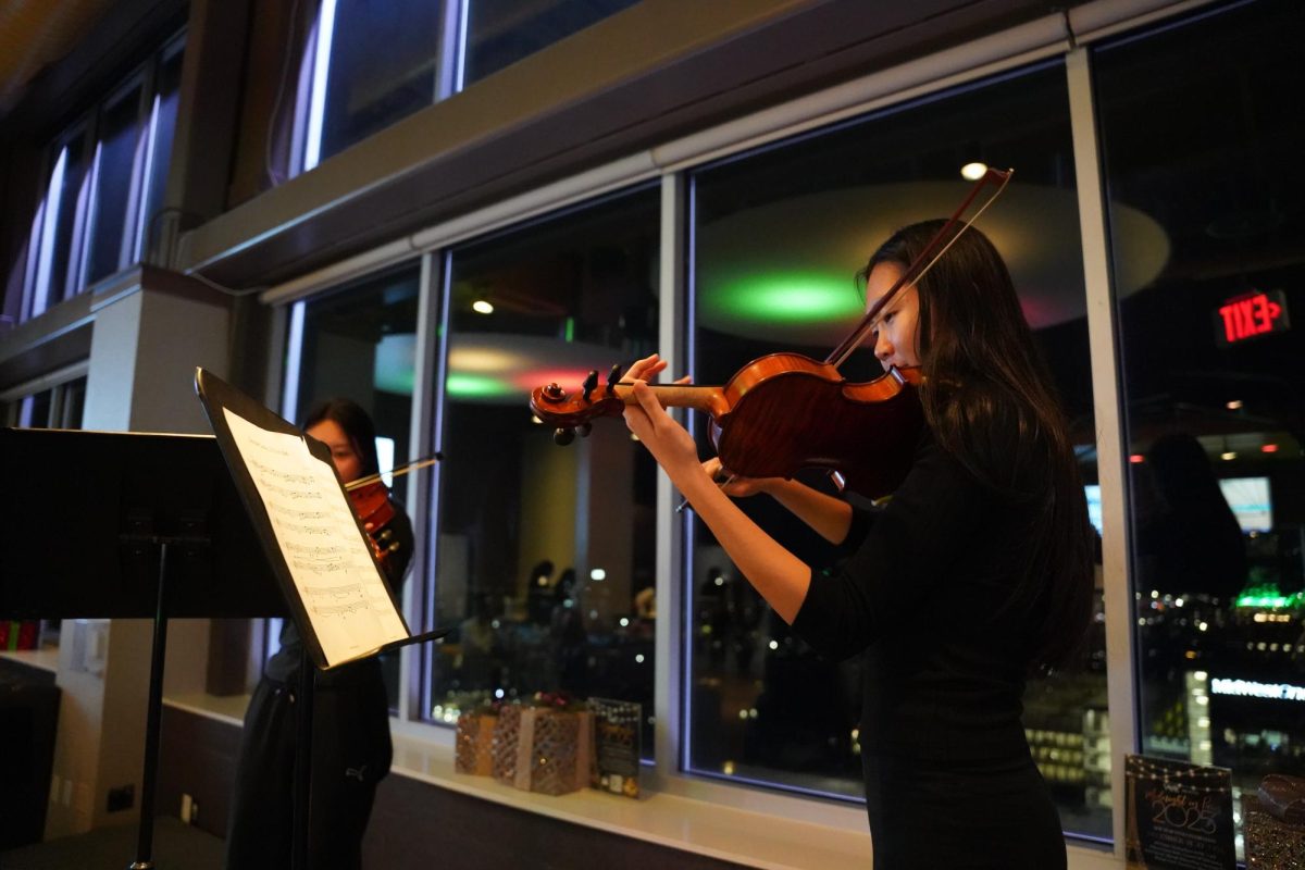 Sabrina Du '25 performs "My Heart Will Go On" with Tina Hong '25 at Cadenza's annual Vue Concert.
