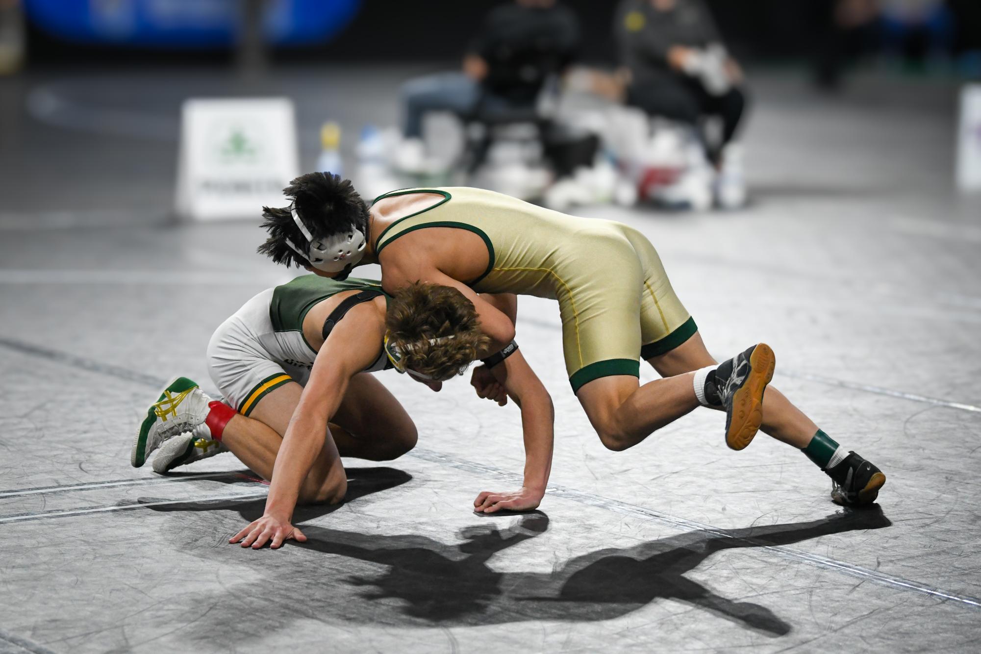 Alexander Pierce '26 goes in for a takedown on Dec. 7 at Xtream Arena. Pierce took second in the 120lb weight class.