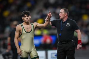 After beating his opponent, Justin Avila '25 is declared the winner Dec. 7 at Xtream Arena. Avila placed second in the 150lb weight class.