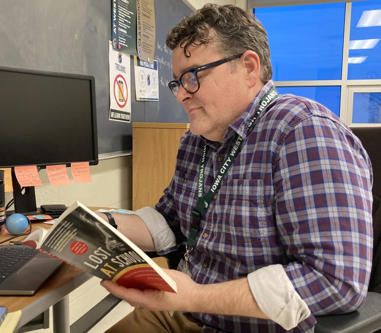 JP. Claussen reads after completing his workday. 