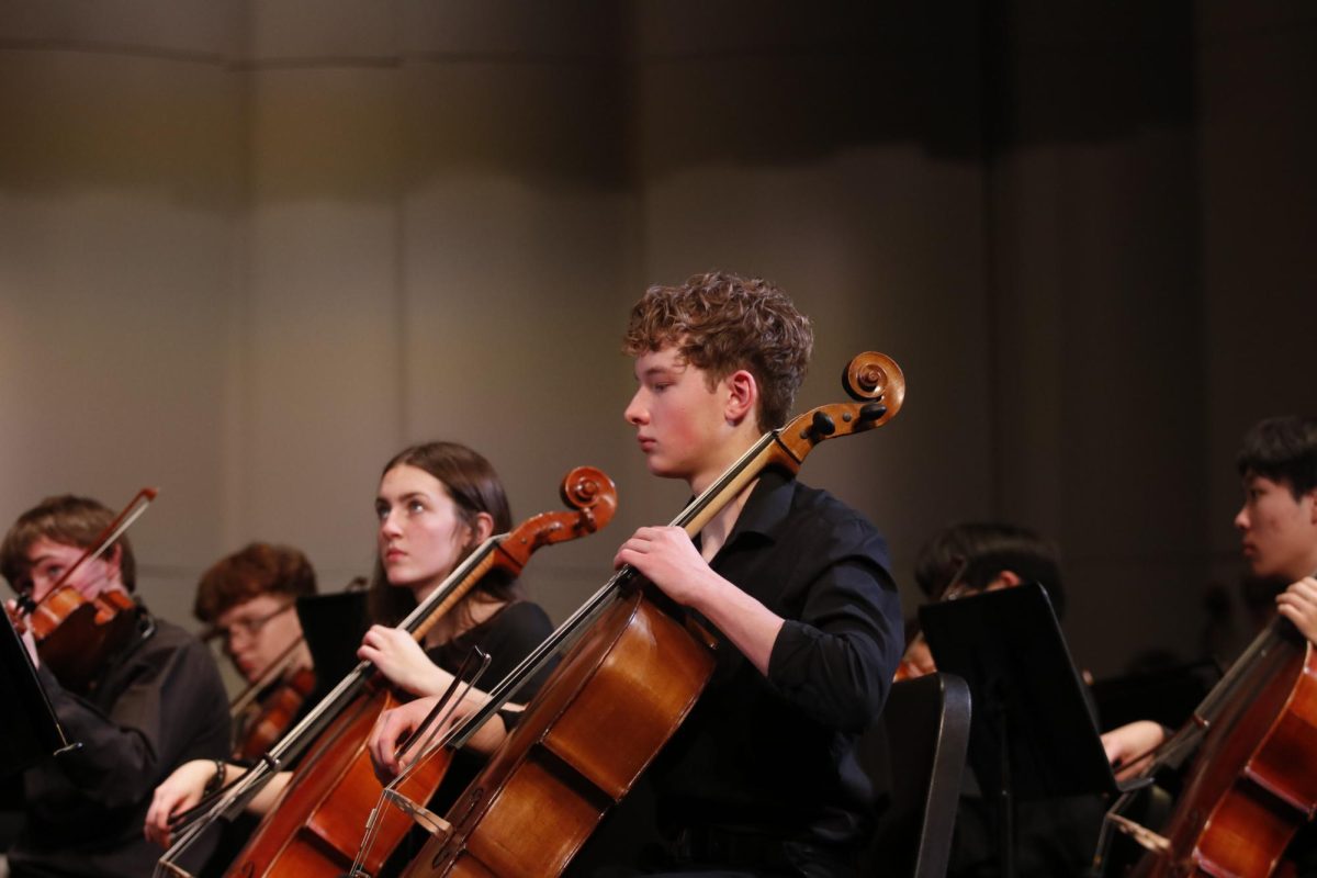 First stand Emery Crawford '25 and Ellie Roetlin '26 lead the cello section at the concert Dec. 12.